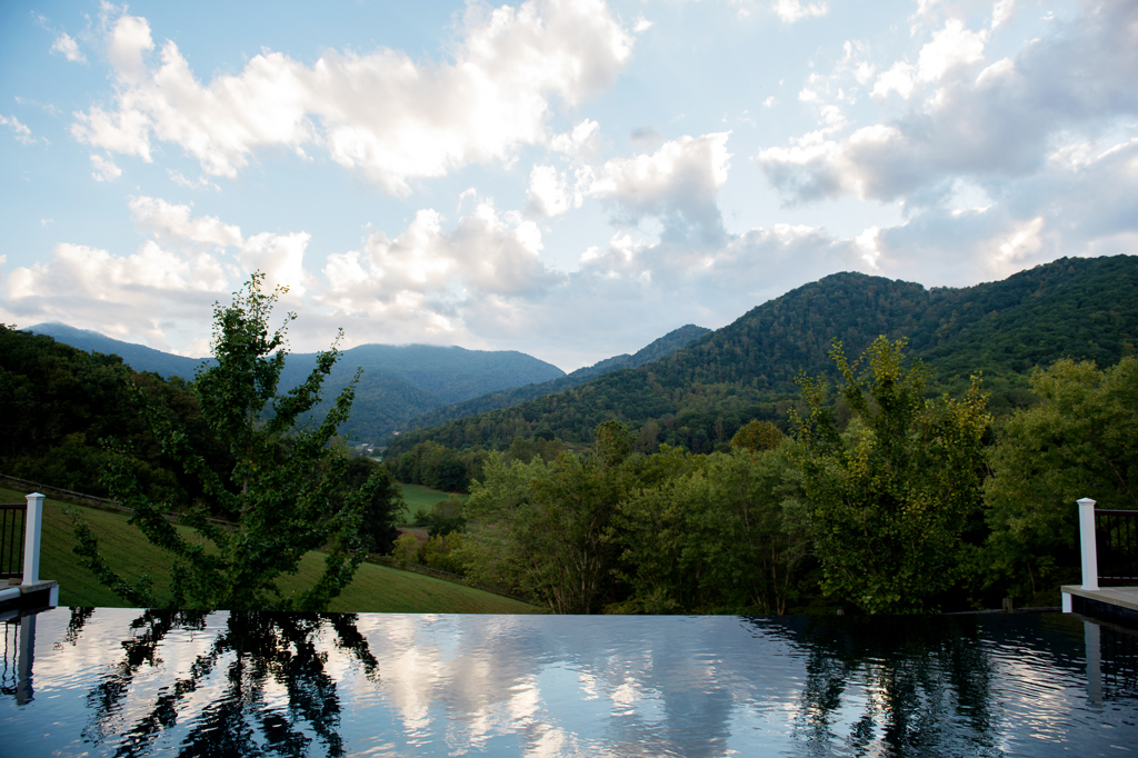 an infinity pool overlooking blue ridge mountains