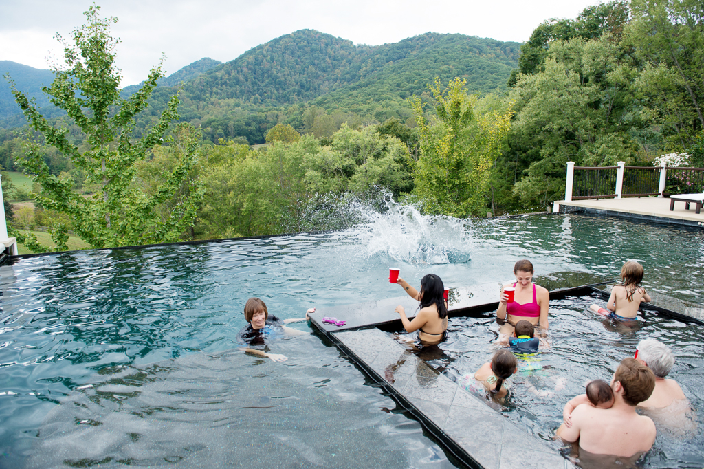 a large splash in an infinity pool overlooking the blue ridge mountains