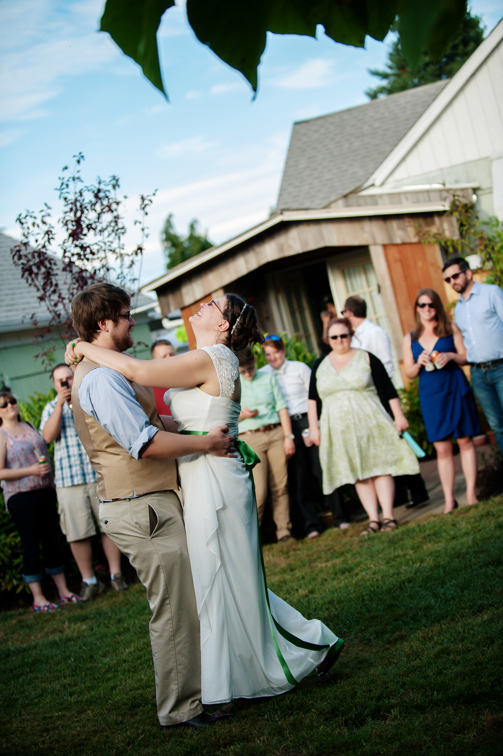 a bride and groom have first dance in their backyard wedding