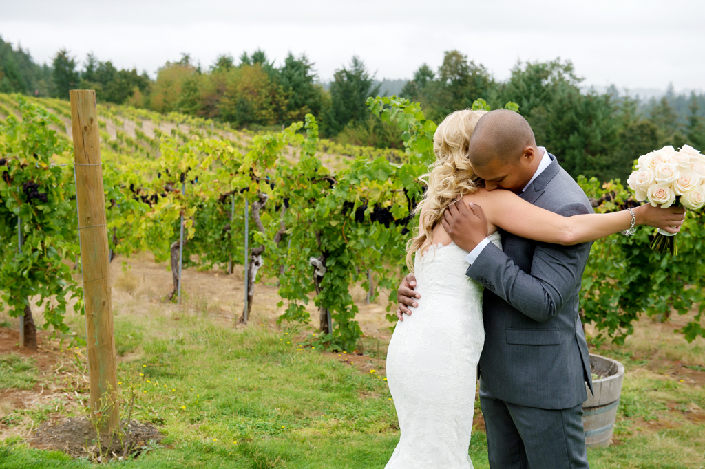 a bride and groom hug at beckenridge vineyard
