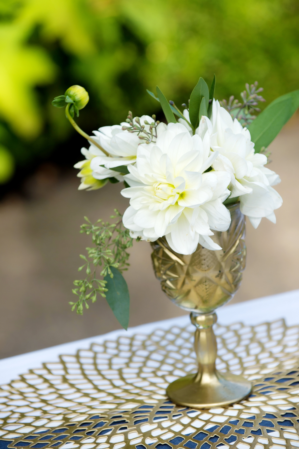 ivory flowers in a gold goblet