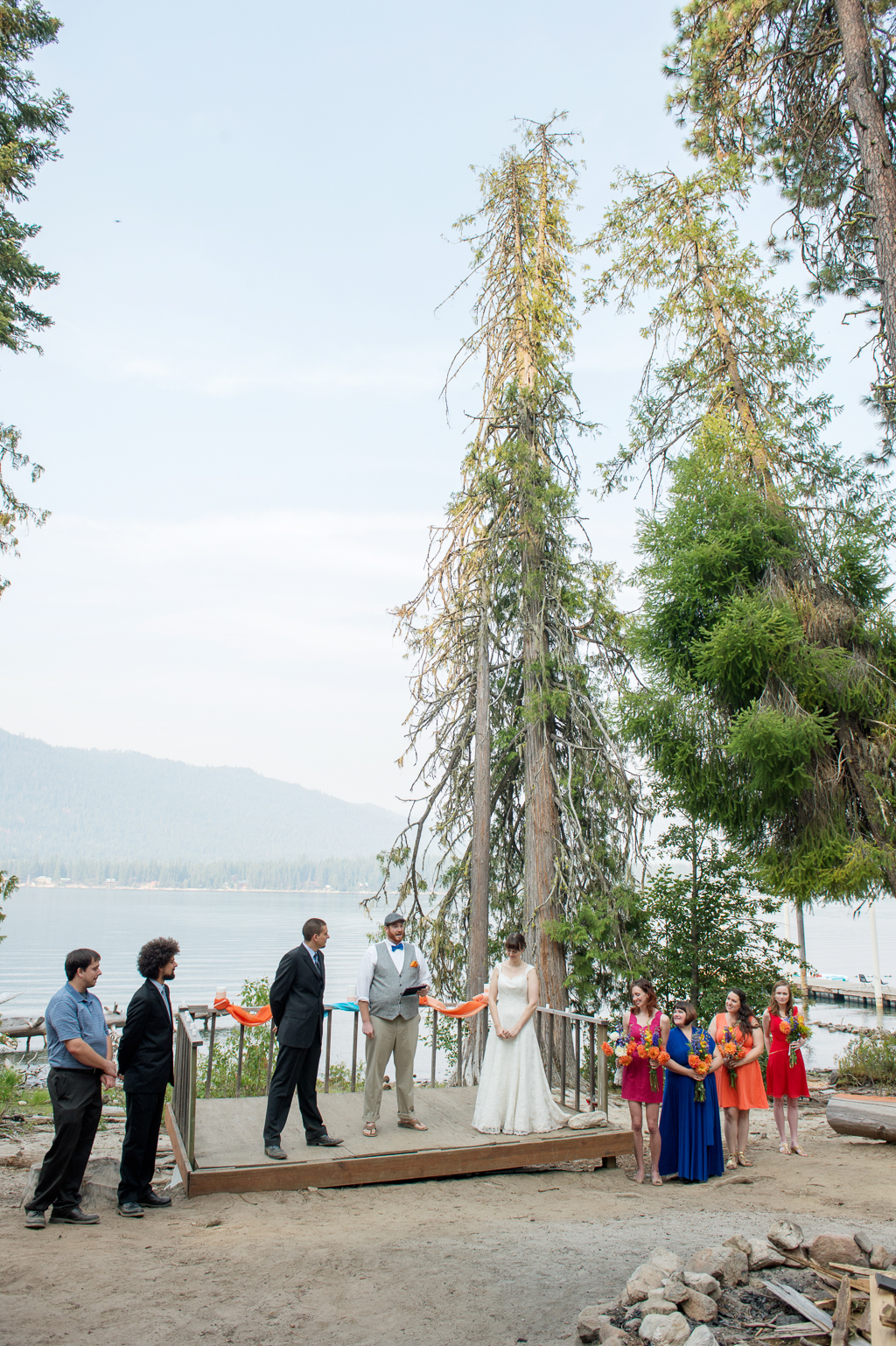 a wedding ceremony oh the shore of lake wenatchee