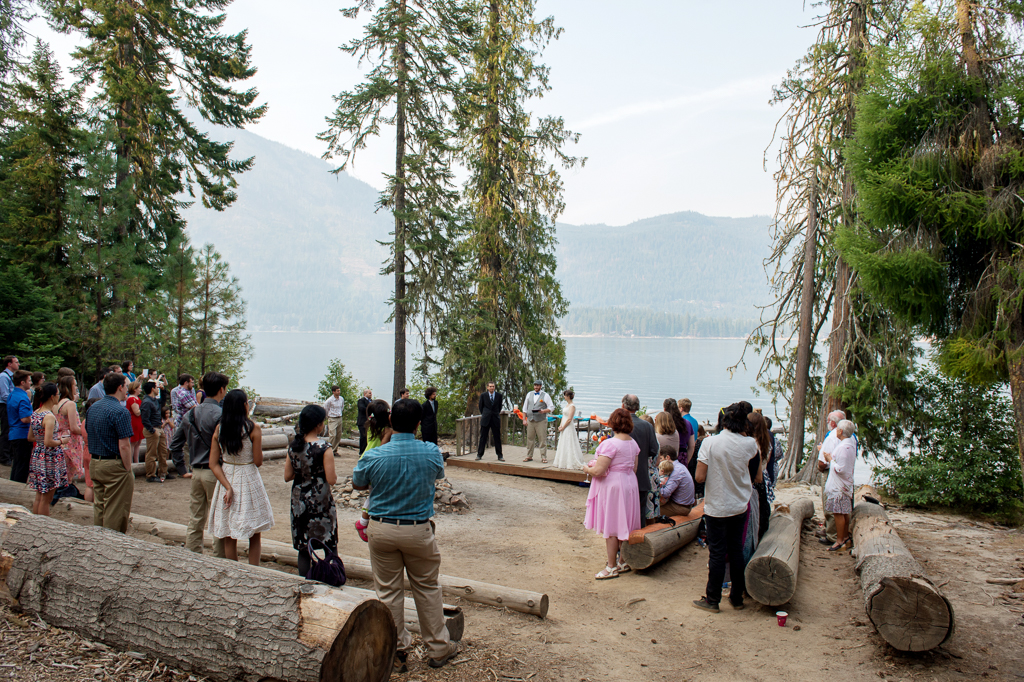 a wedding ceremony oh the shore of lake wenatchee