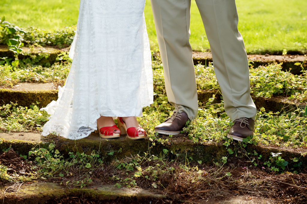 bride wears red wedding shoes