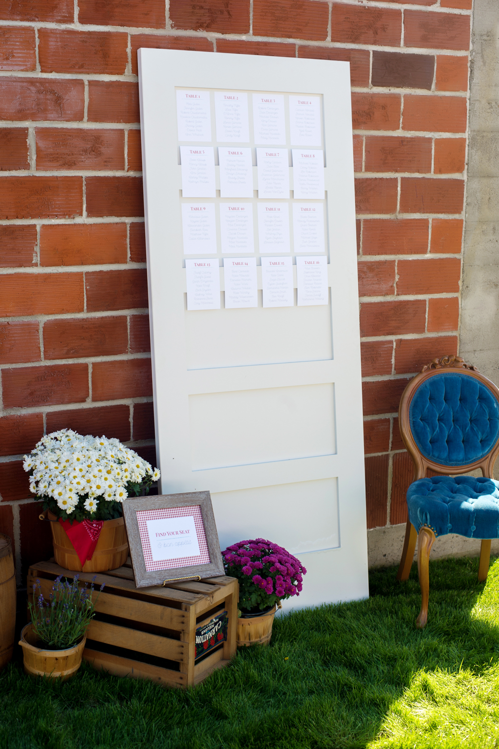 an old door has seating chart for wedding guests