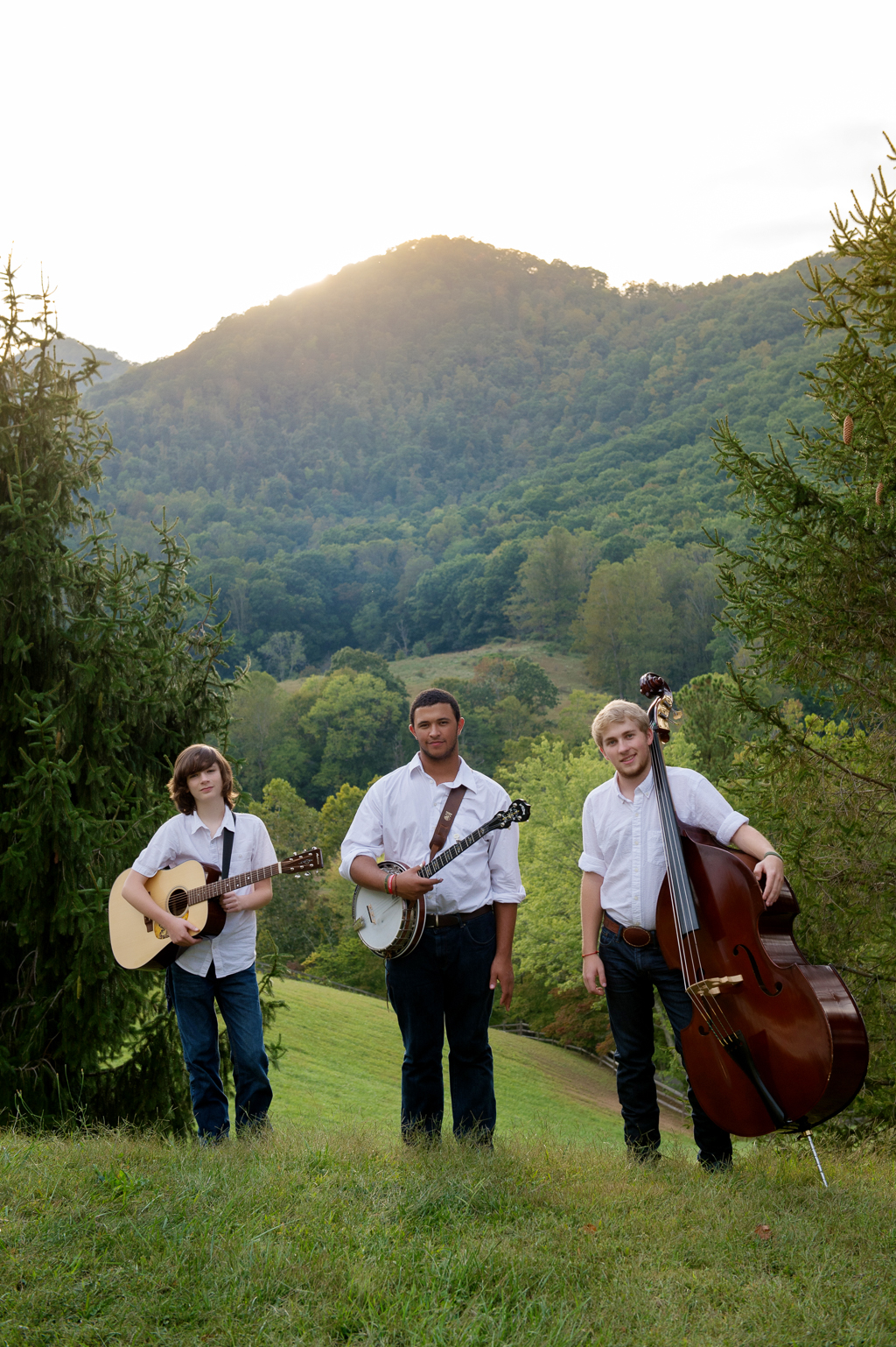 cane mill road pose with their instruments in front of mountains