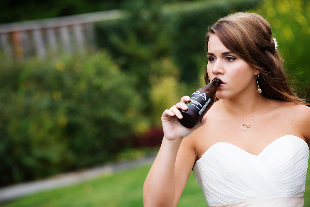 a bride drinks a beer