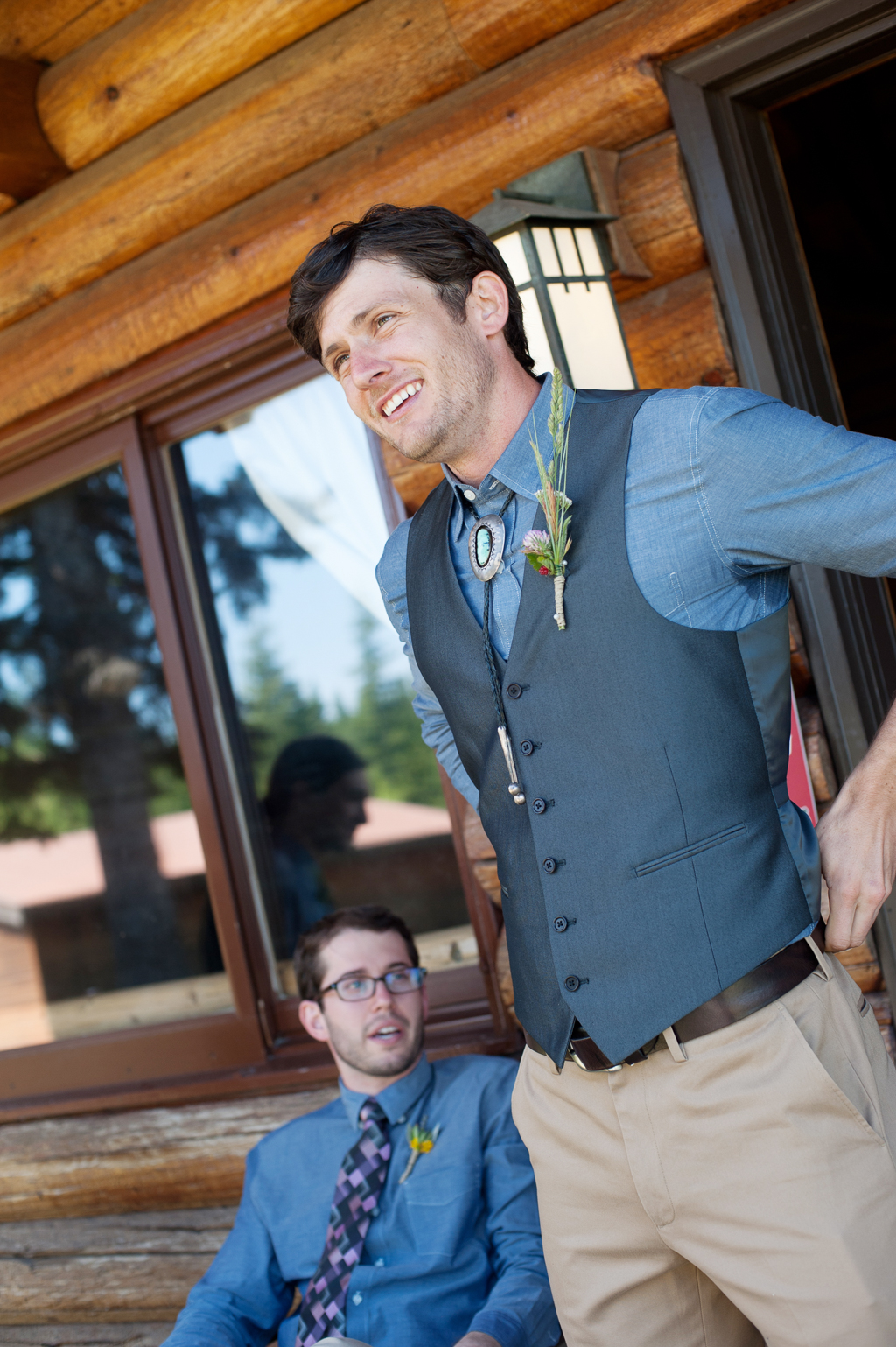 groom wears a turquoise bolo tie at his wedding