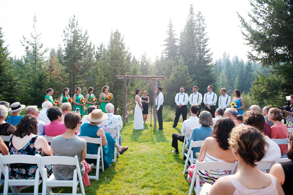 a wedding ceremony behind the cabin at cooper spur surrounded by forest fire smoke that makes the sky and trees look foggy