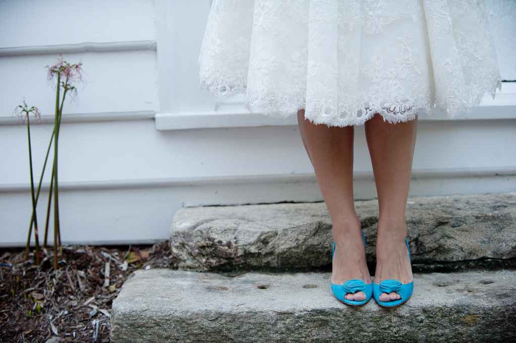 tea length lace wedding dress and turquoise shoes