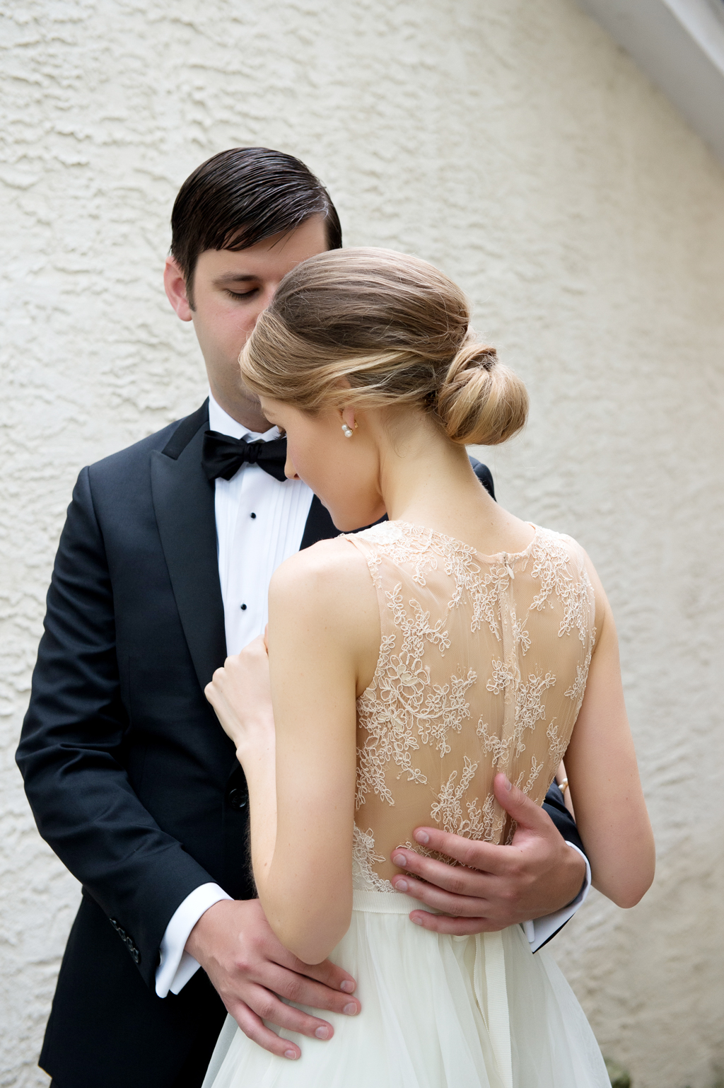 beautiful lace back wedding dress and hair in bun