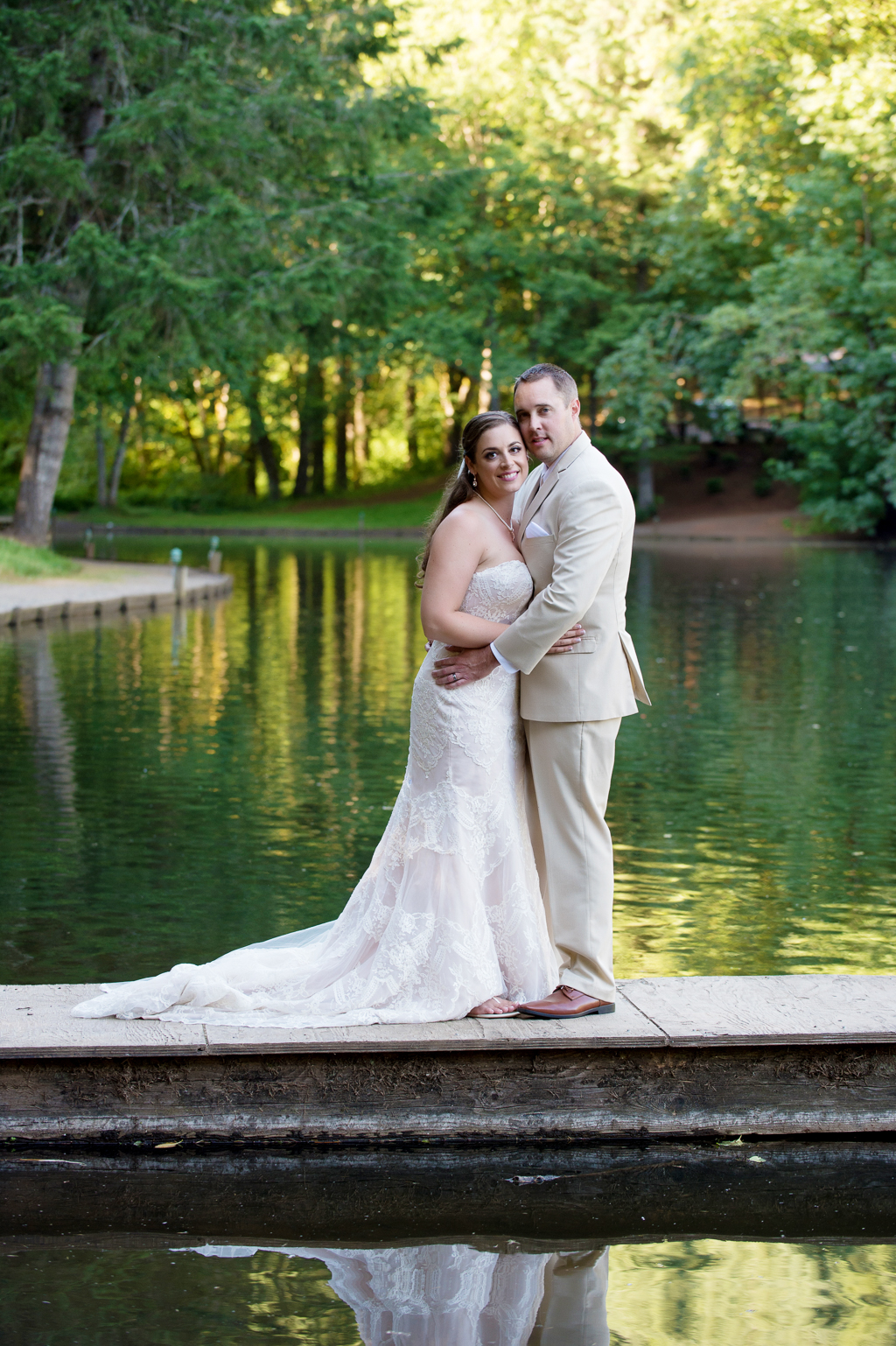 bride and groom stand on dock at horning's hideout