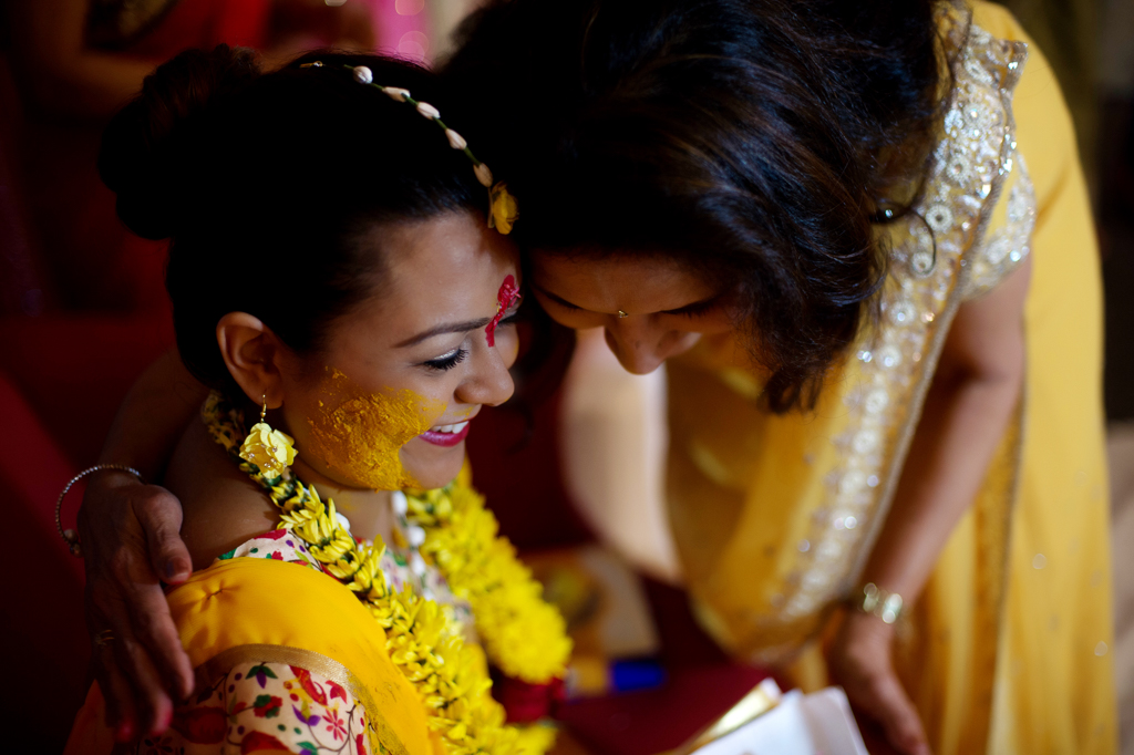 a mother had a tender moment with her daughter during the turmeric ceremony at an indian wedding