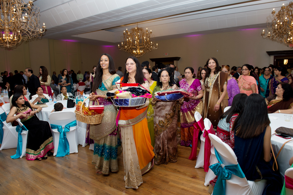 women bring gifts for the couple during indian wedding