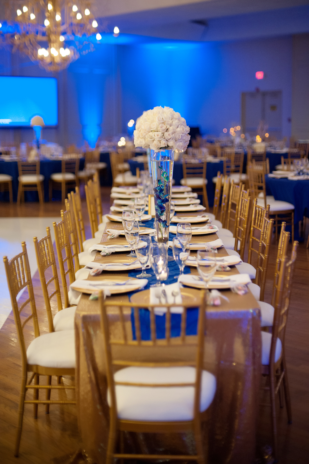 gold and royal blue wedding reception decor