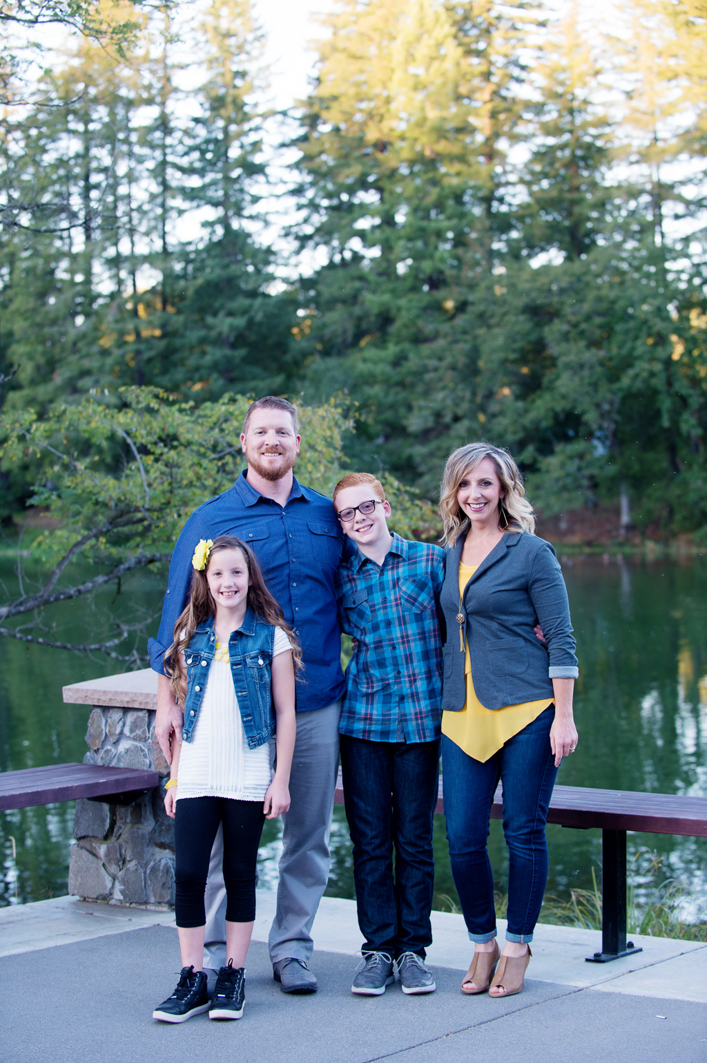 a family of 4 stand in front of lacamas lake