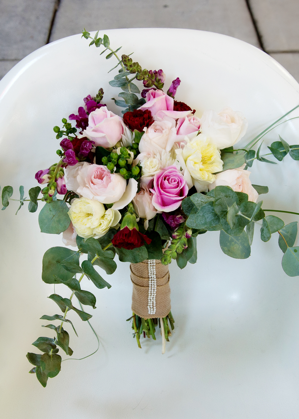 a pretty ivory pink and maroon bouquet