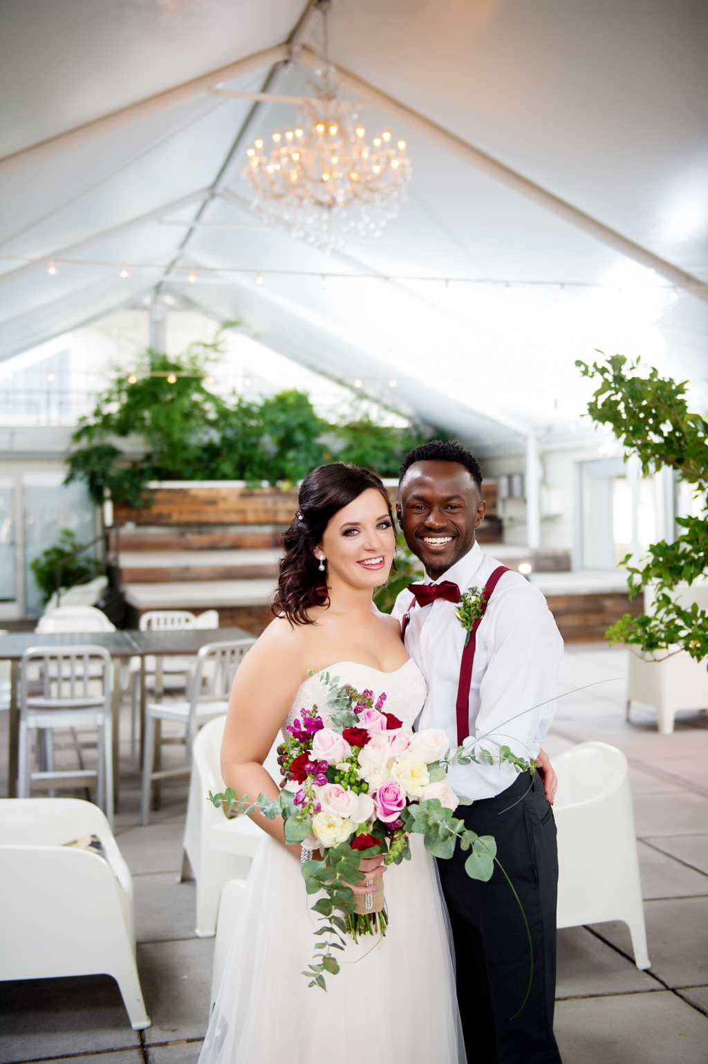 bride and groom pose and smile inside jupiter hotel