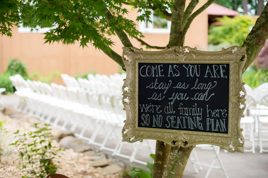 Sign that tells guest to seat themselves when they arrive at the wedding ceremony at Thorburg Oasis