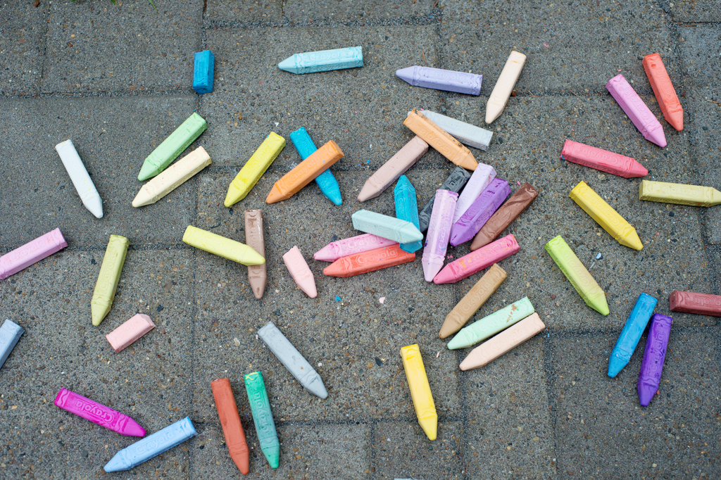 Crayons laying on the ground which can be a great thing for kids to play with during the reception of a wedding in Thorburg Oasis