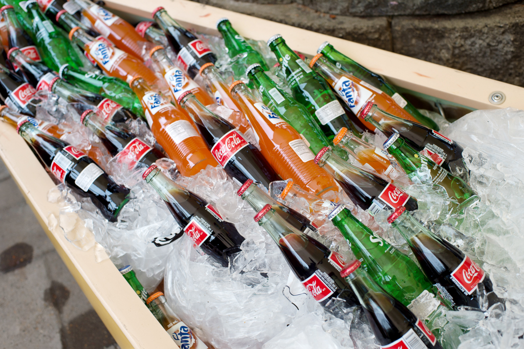 a canoe is filled with ice and soda for the wedding reception