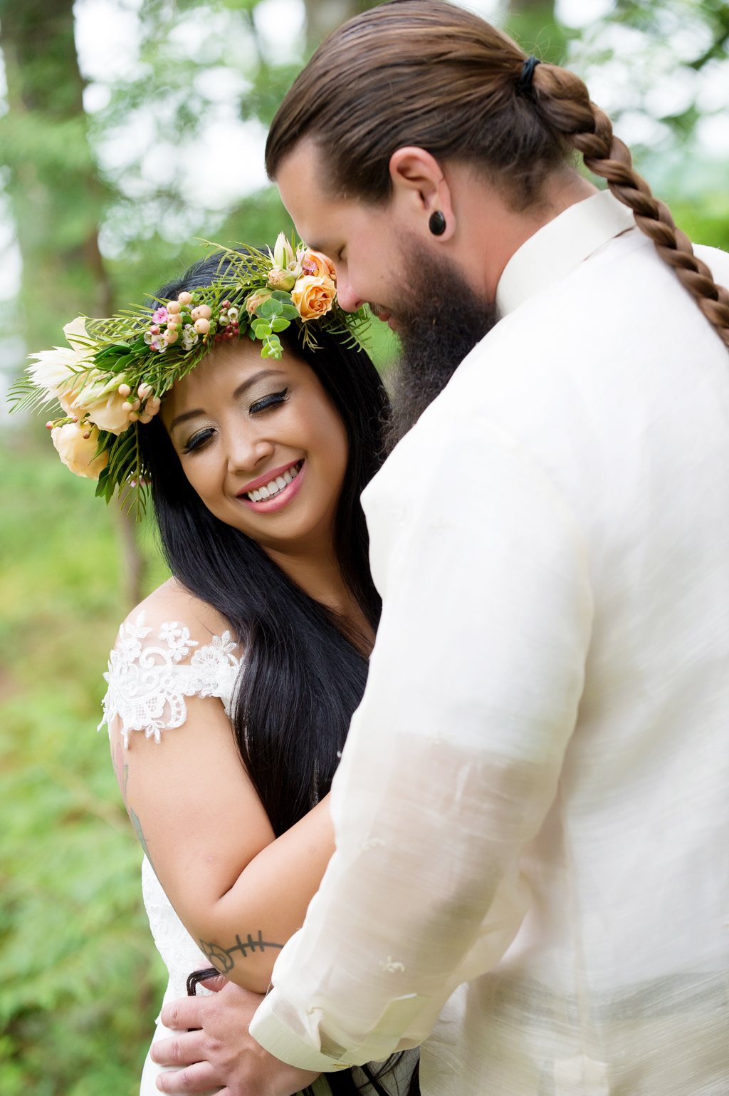a bride in a pretty yellow flower crown has an intimate moment with her groom