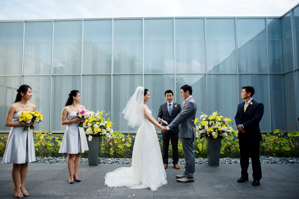 a wedding ceremony in the courtyard at ncma