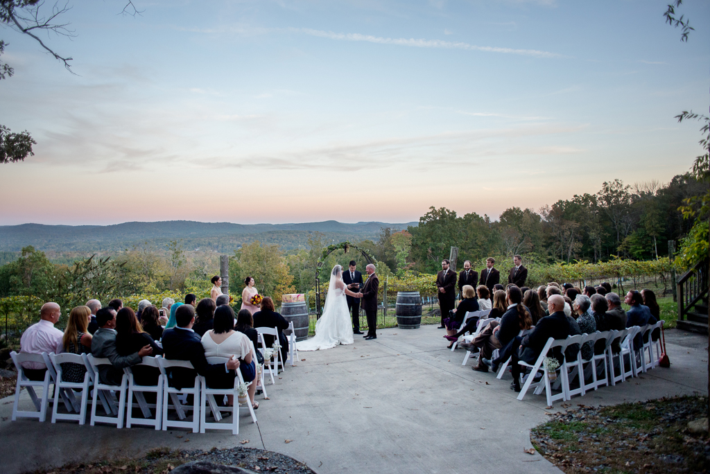 wedding ceremony at sunset overlooking stony mountain vineyards