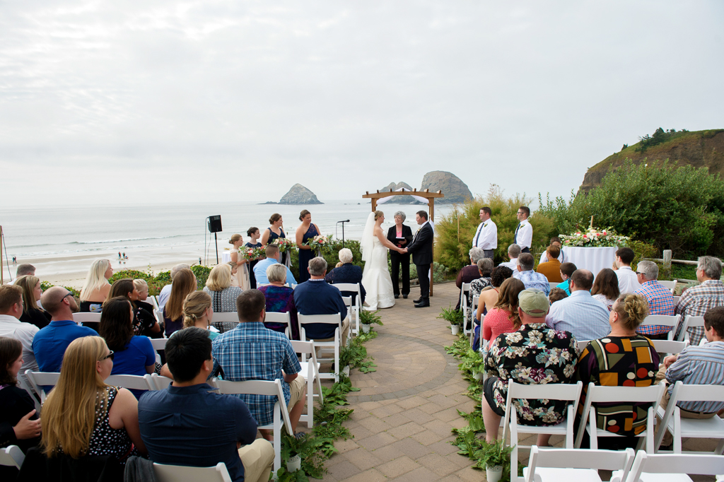 a wedding ceremony at oceanside community club overlooking the ocean