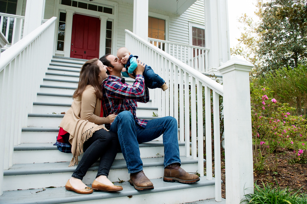 a family sits on the steps at poplar grove plantation house