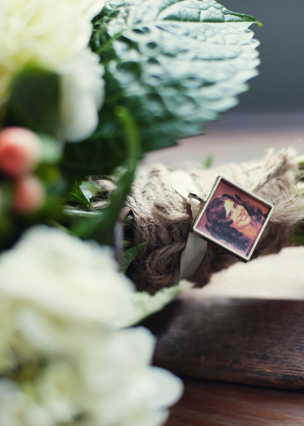 a photo of bride's mother adorns wedding bouquet