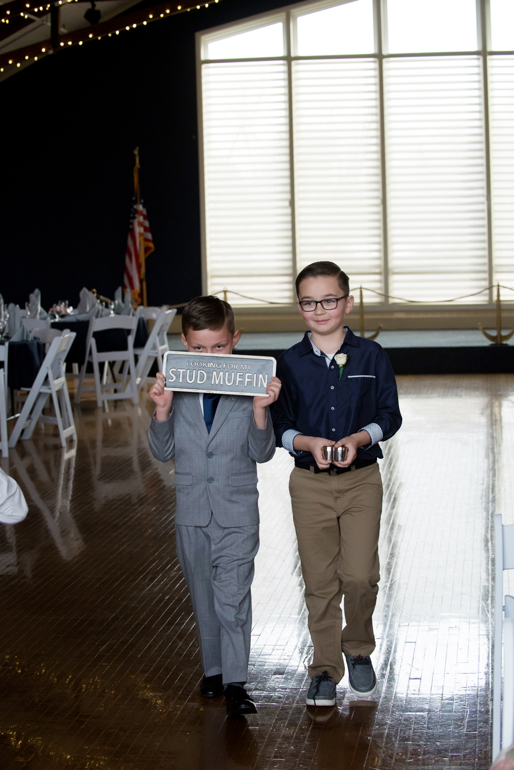 ring bearers carry looking for my stud muffin sign
