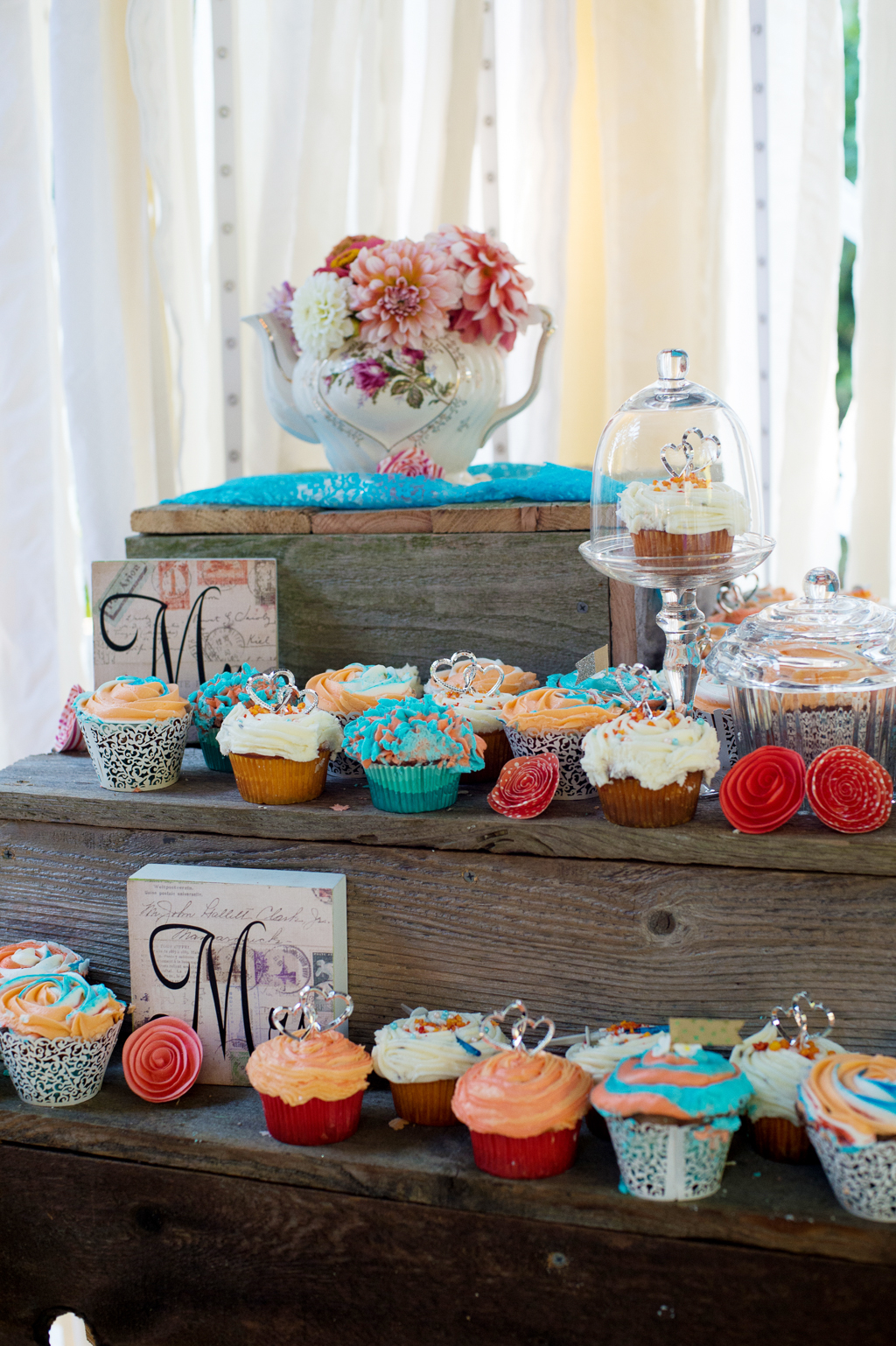 turquoise and peach cupcakes and mismatched china