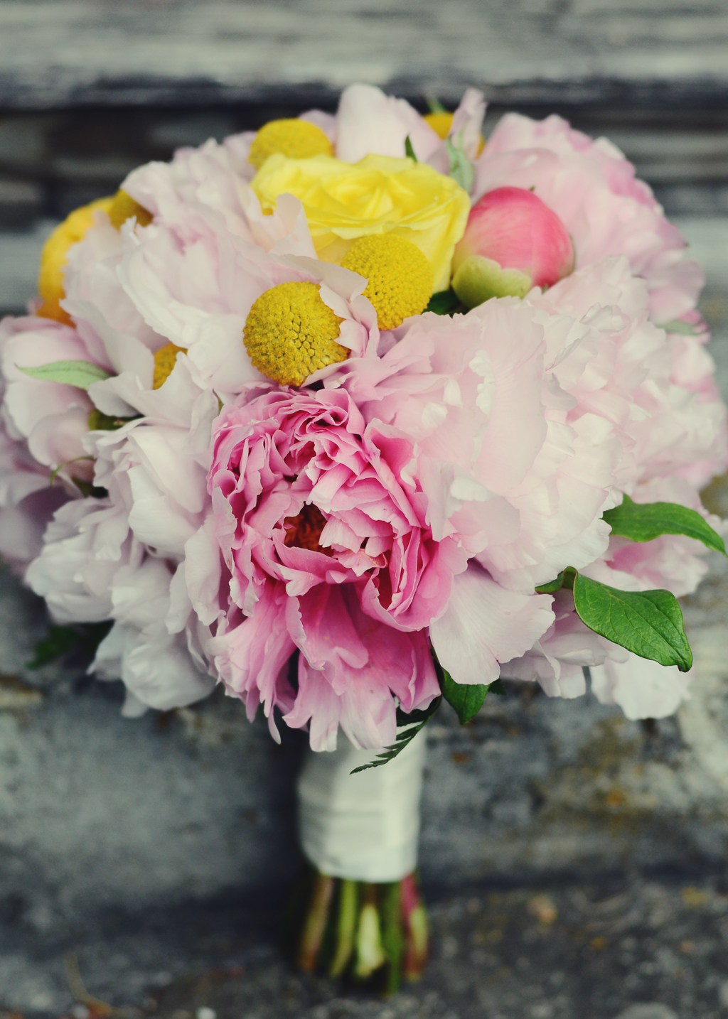 a pink and yellow wedding bouquet