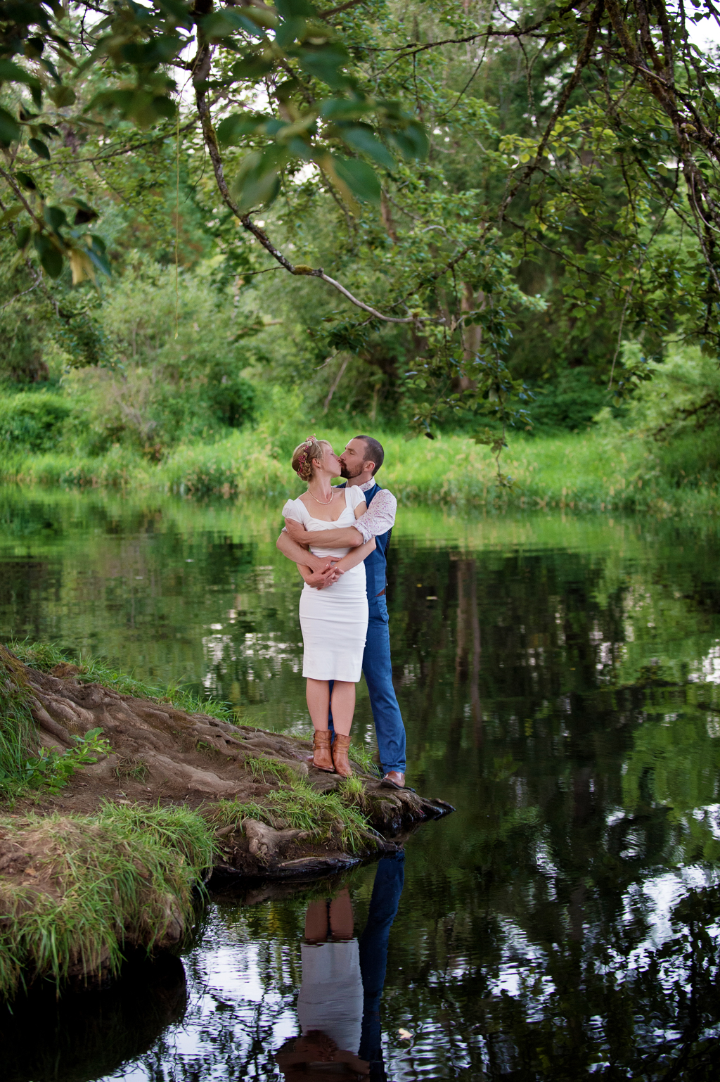 a bride and groom embrace on the bank of nehalem river at hawkins park