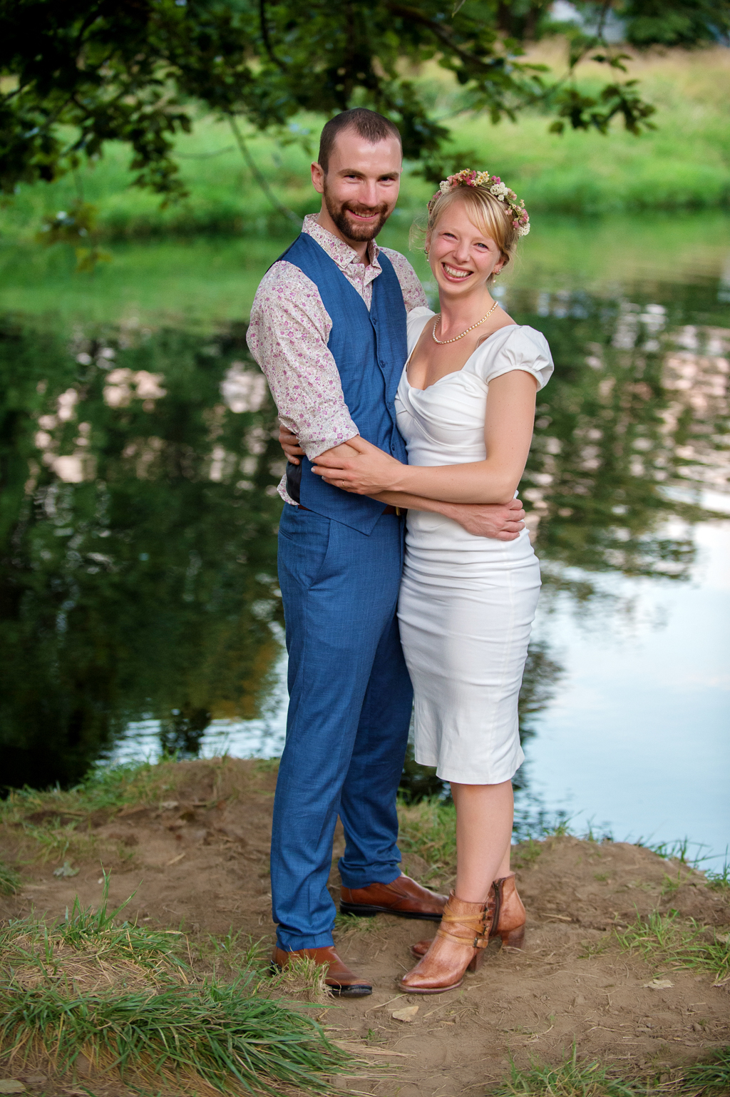 a just married couple stand in front of nehalem river in hawkins park