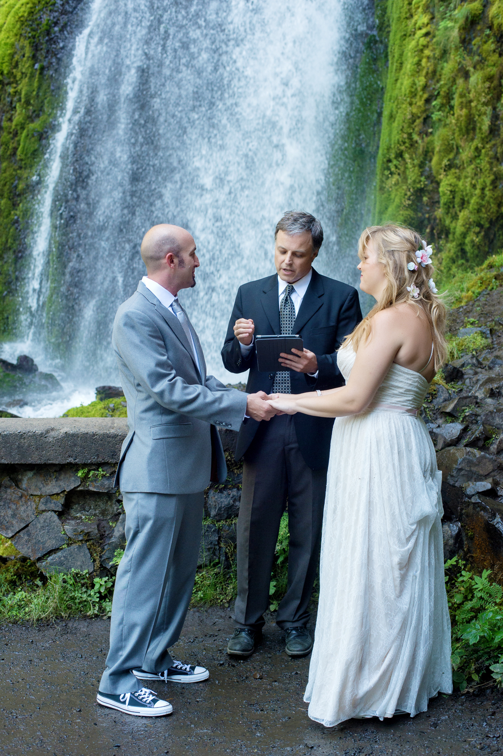 a bride and groom elope in front of wahkeena falls