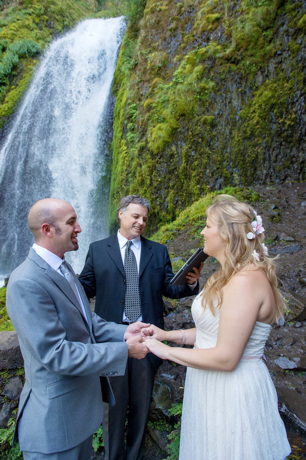 bride and groom exchange vows in front of wahkeena falls