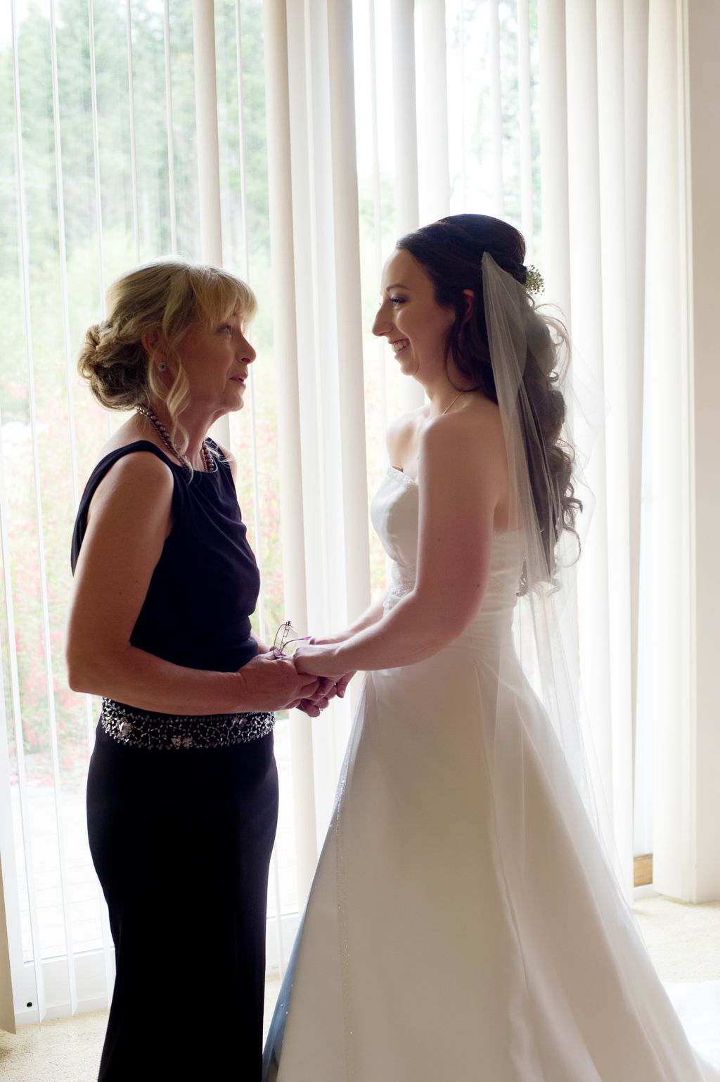 a mom and bride have a special moment before a wedding