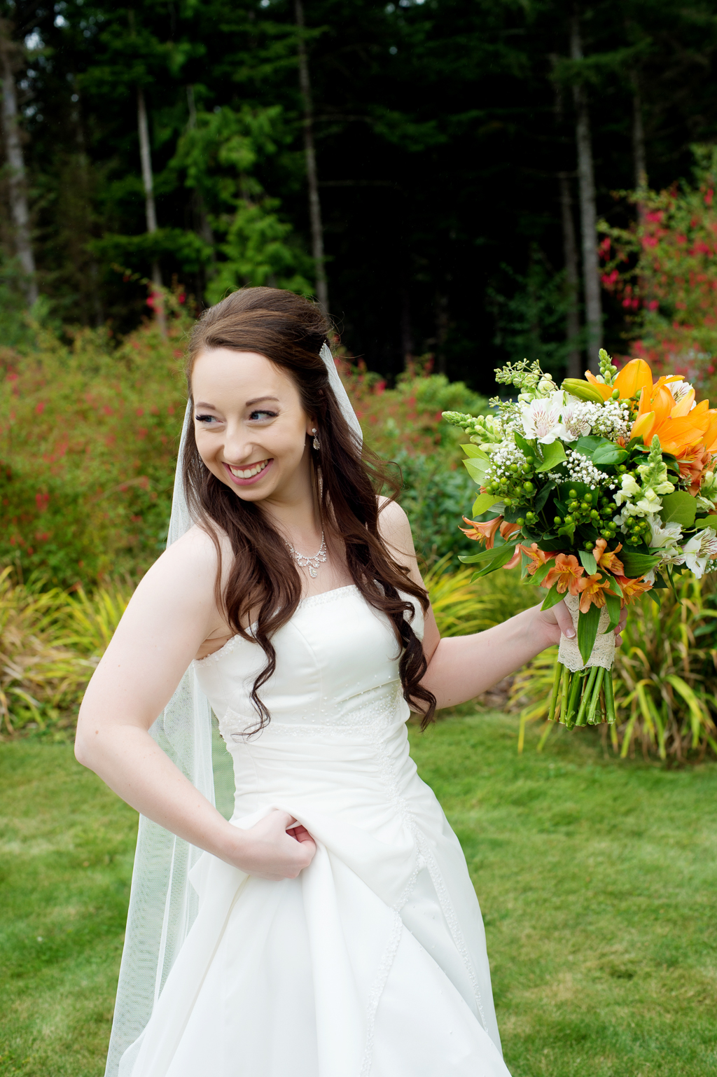 bride holds a bouquet of orange tiger lillies