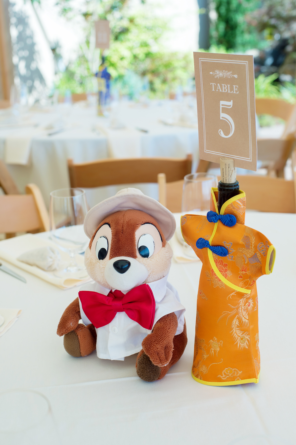 chip and dale rescue ranger stuffed animal sits on table center as wedding reception decor