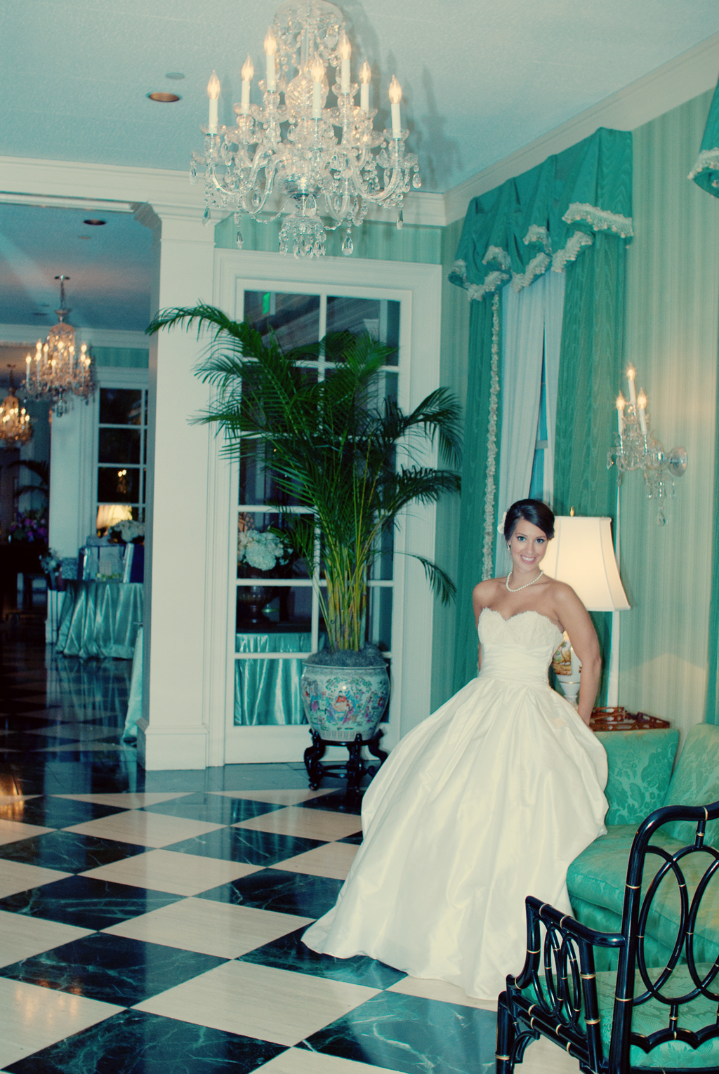 bride bathed in pretty green light in parlor of forsyth country club