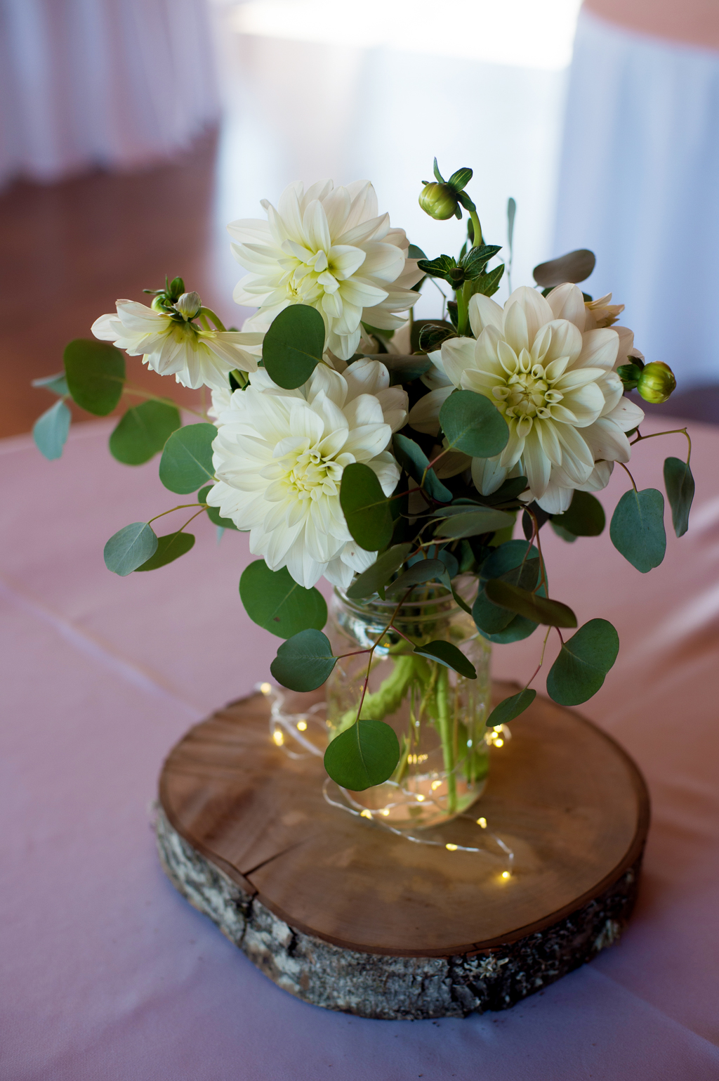 ivory flowers on a table at a wedding reception