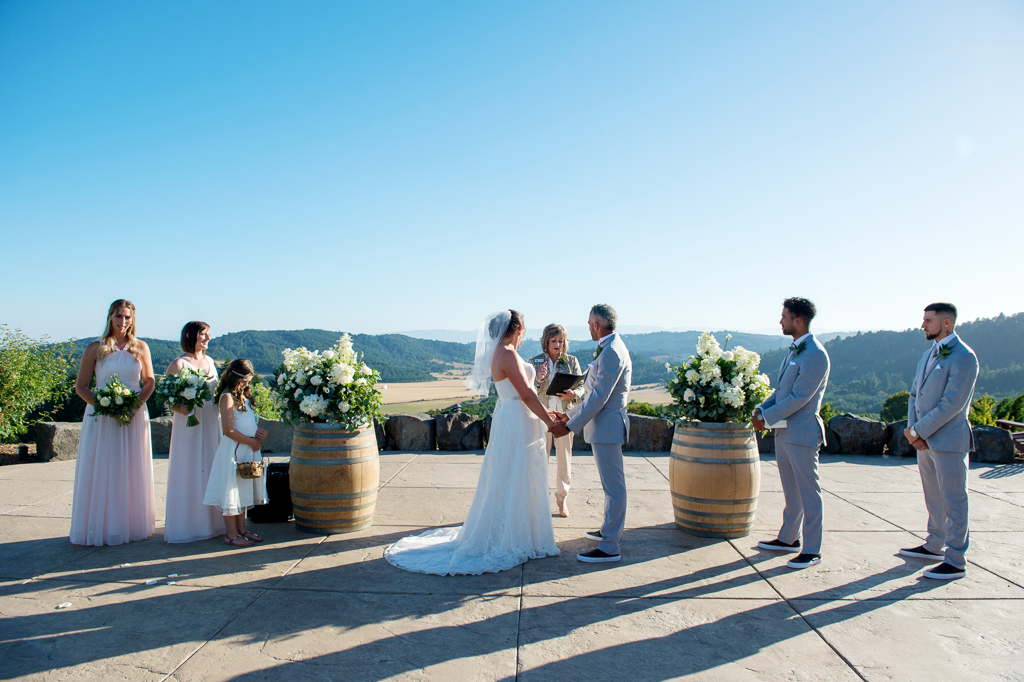 a wedding ceremony outdoors at youngberg hill vineyards