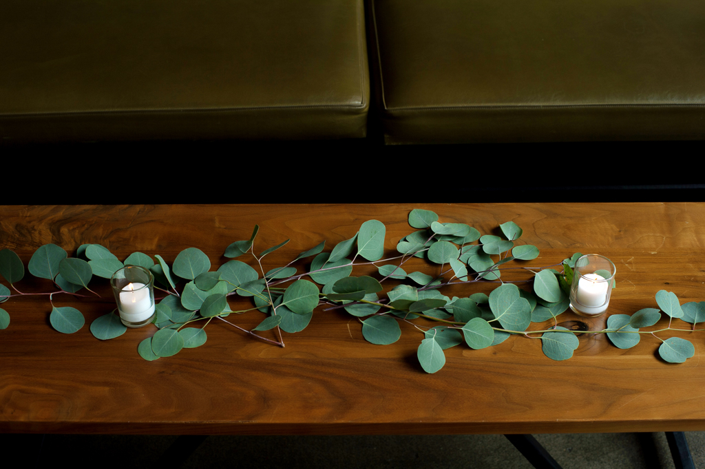 eucalyptus leaves lay across tables at coopers hall