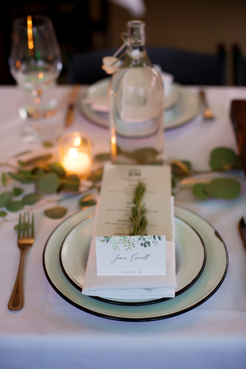 rosemary candles and eucalyptus decorate a wedding reception table at coopers hall