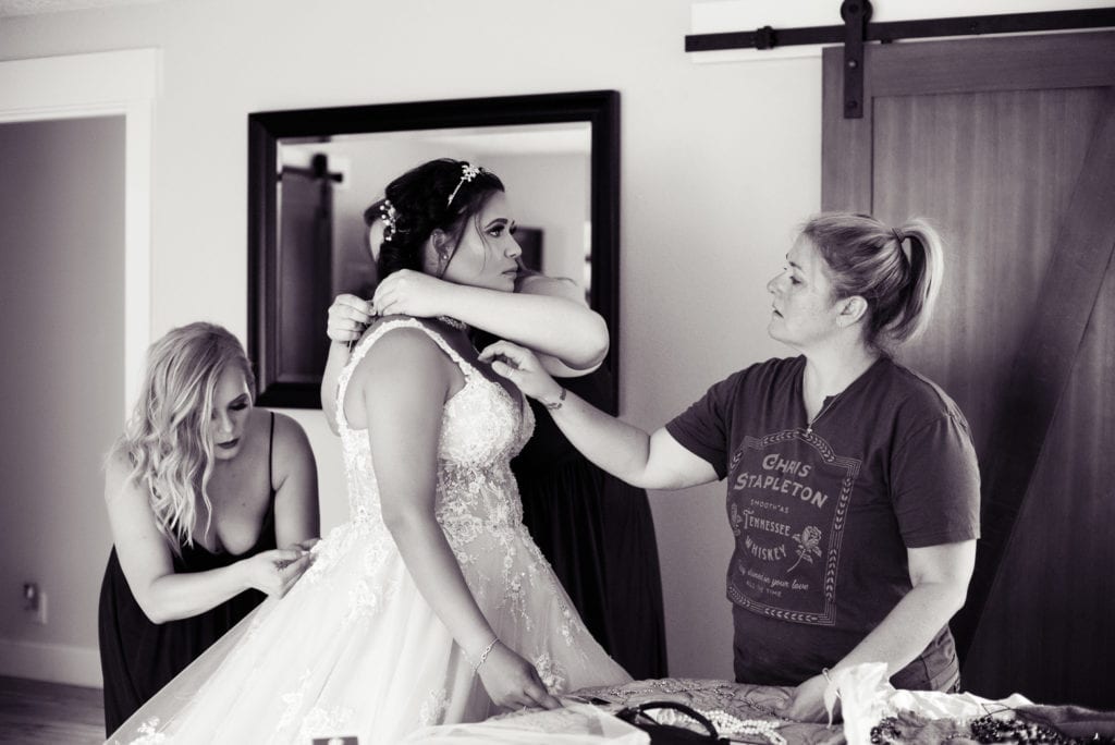 everyone helps the bride get ready on her wedding day