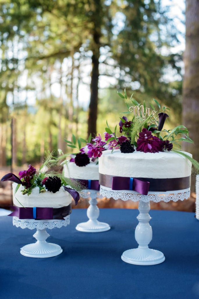3 tiers of cakes in purple and blue by Blondie Cakes PDX